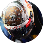 Close-up of a racing helmet with Red Bull and Renault logos and tally marks scratched on the visor.