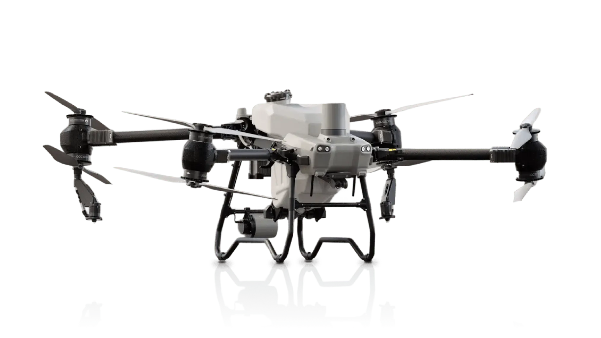 Agras T50 drone with four propellers and central spray tank for crop spraying.