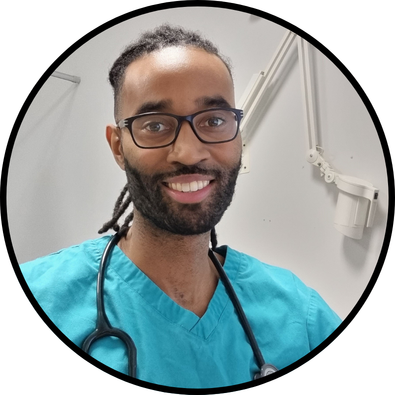 Dr Lewis Thomas, GP and sickle cell educator, smiling in clinical setting