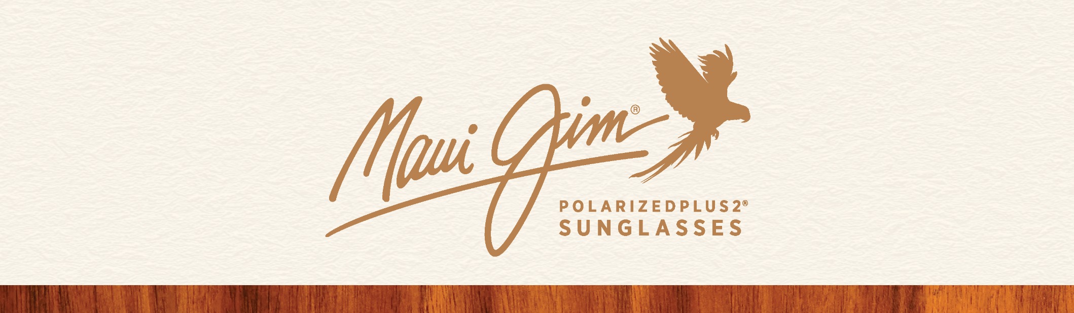 Maui Jim logo with a flying bird and text PolarizedPlus2 sunglasses on a beige background.