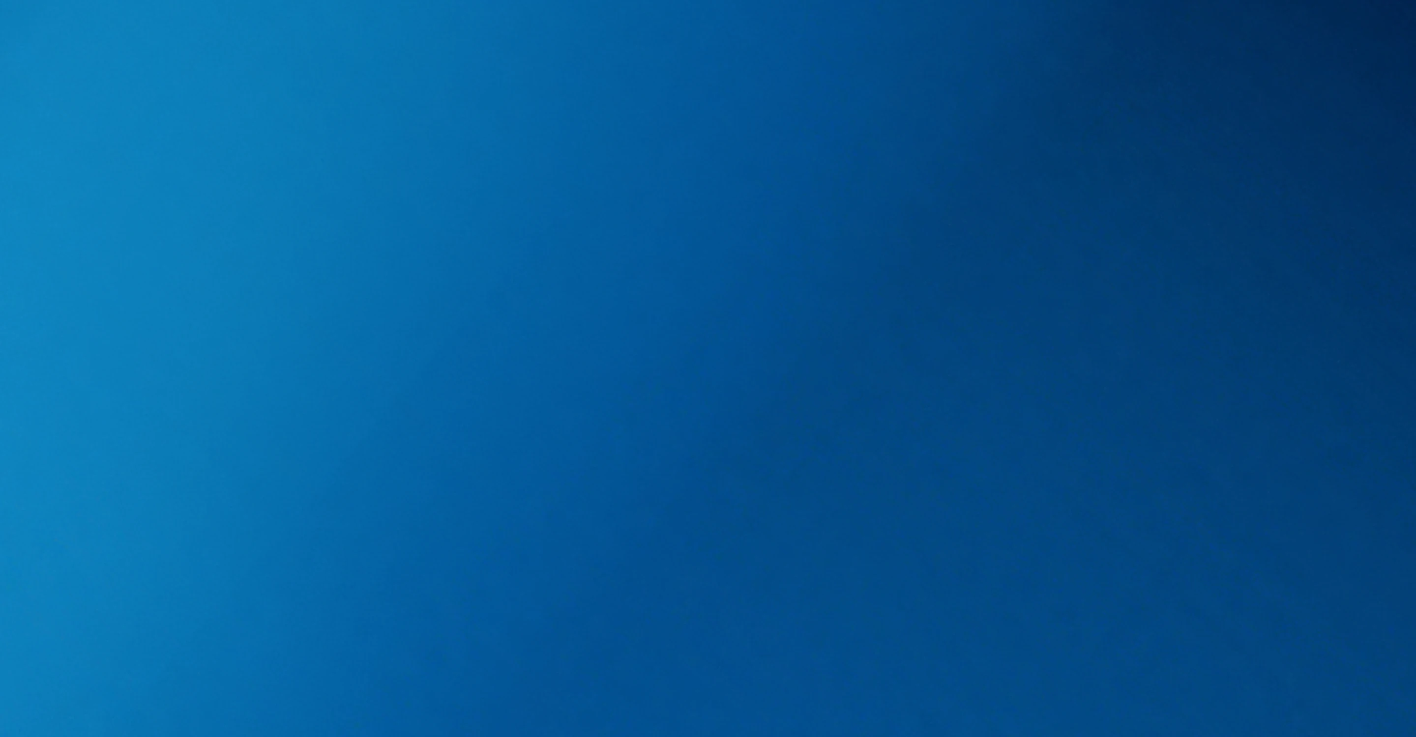 Smooth gradient background transitioning from light blue to dark blue.