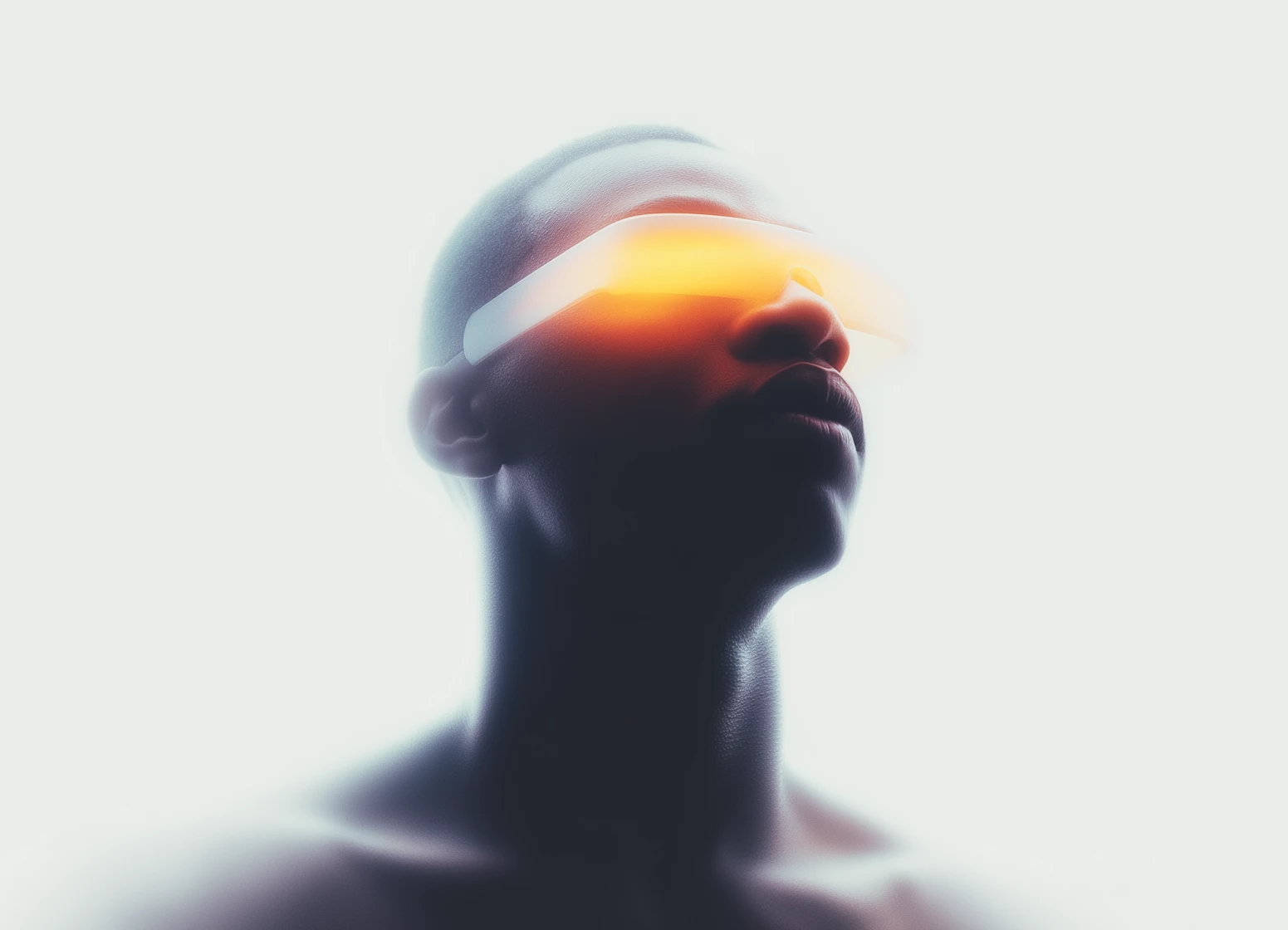 Portrait of a person wearing glowing futuristic yellow-orange VR or smart glasses against a soft white background.