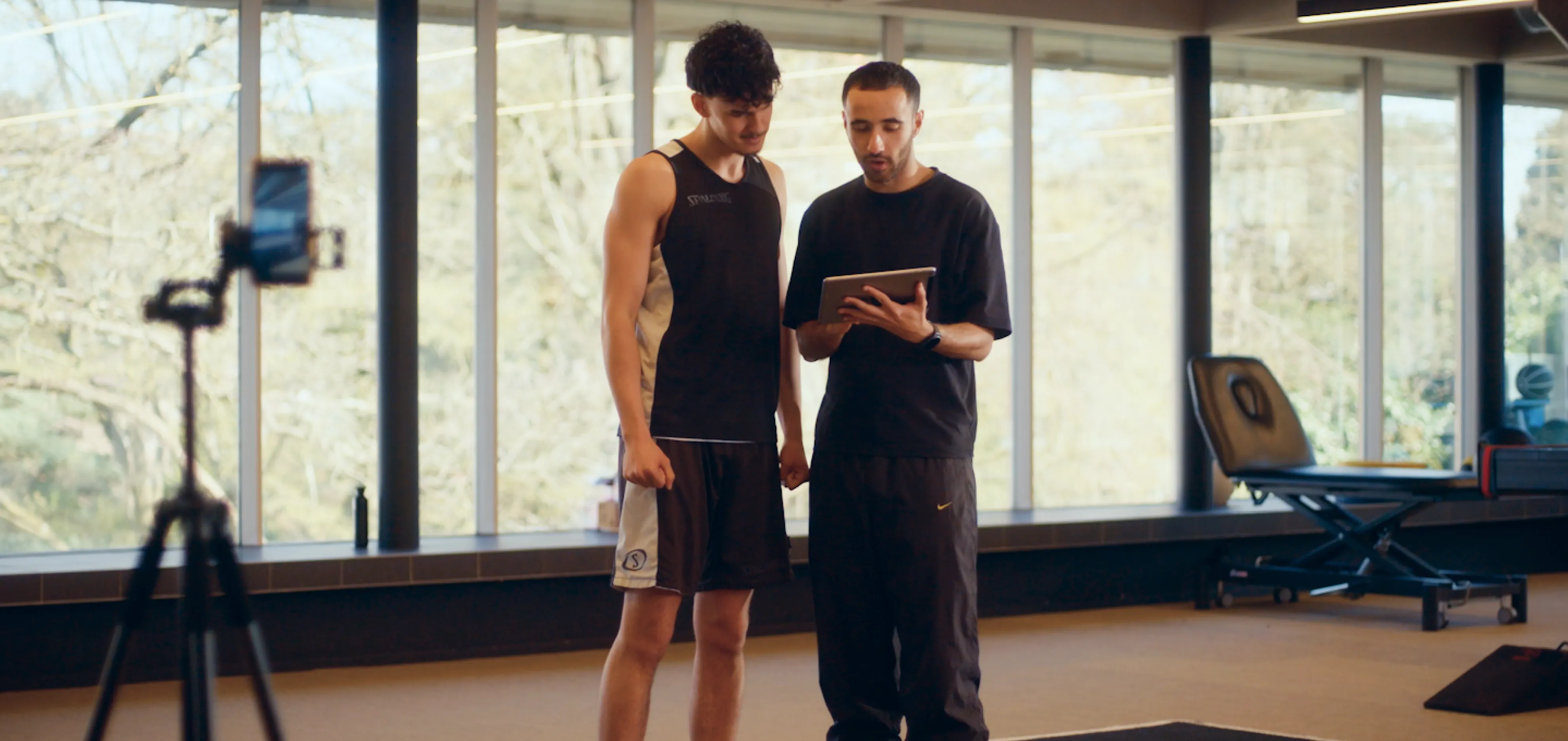 Clinician conducting objective movement assessment with a patient using Model Health