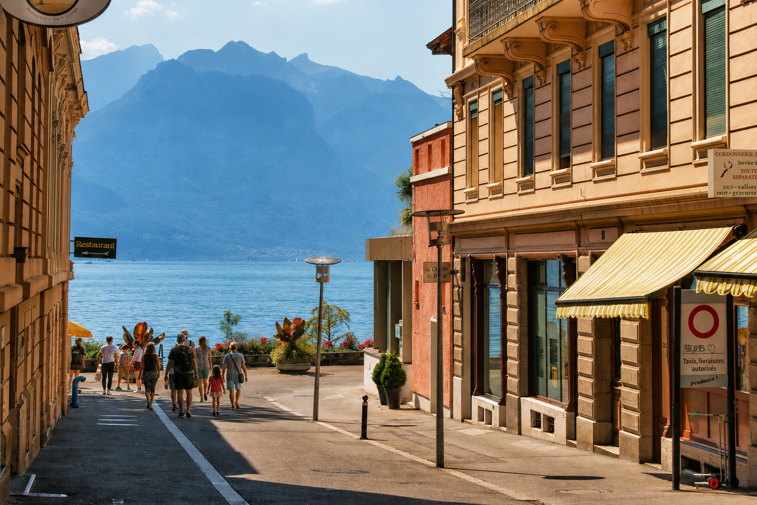 Vue d'une terrasse de restaurant à Vevey proprement nettoyée le matin avant le service, tables dressées, sol en pierre lavé, Lac Léman visible en arrière-plan, lumière dorée du matin.