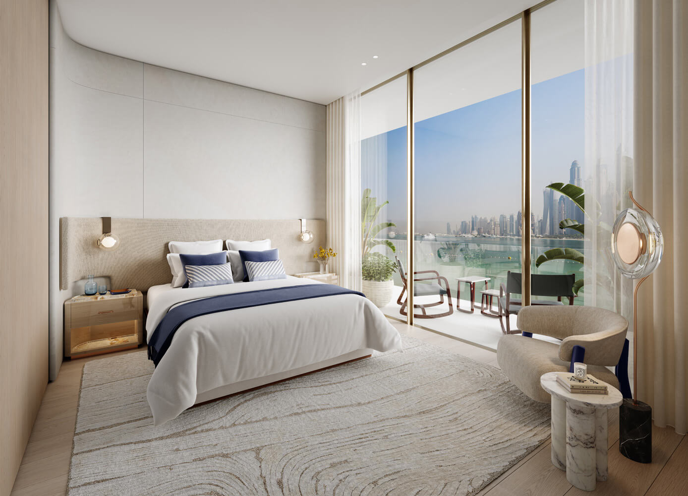 Bright modern bedroom with large bed, beige upholstery, blue accents, balcony with city skyline view, and cozy seating area.