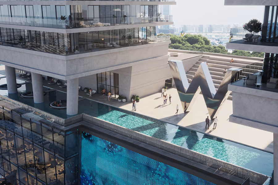 Modern building terrace with a large reflective silver letter W sculpture, a swimming pool, and people walking and relaxing.