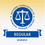 Seal of the National Association of Criminal Defense Lawyers with the words Regular Member in a blue banner below the scales of justice.