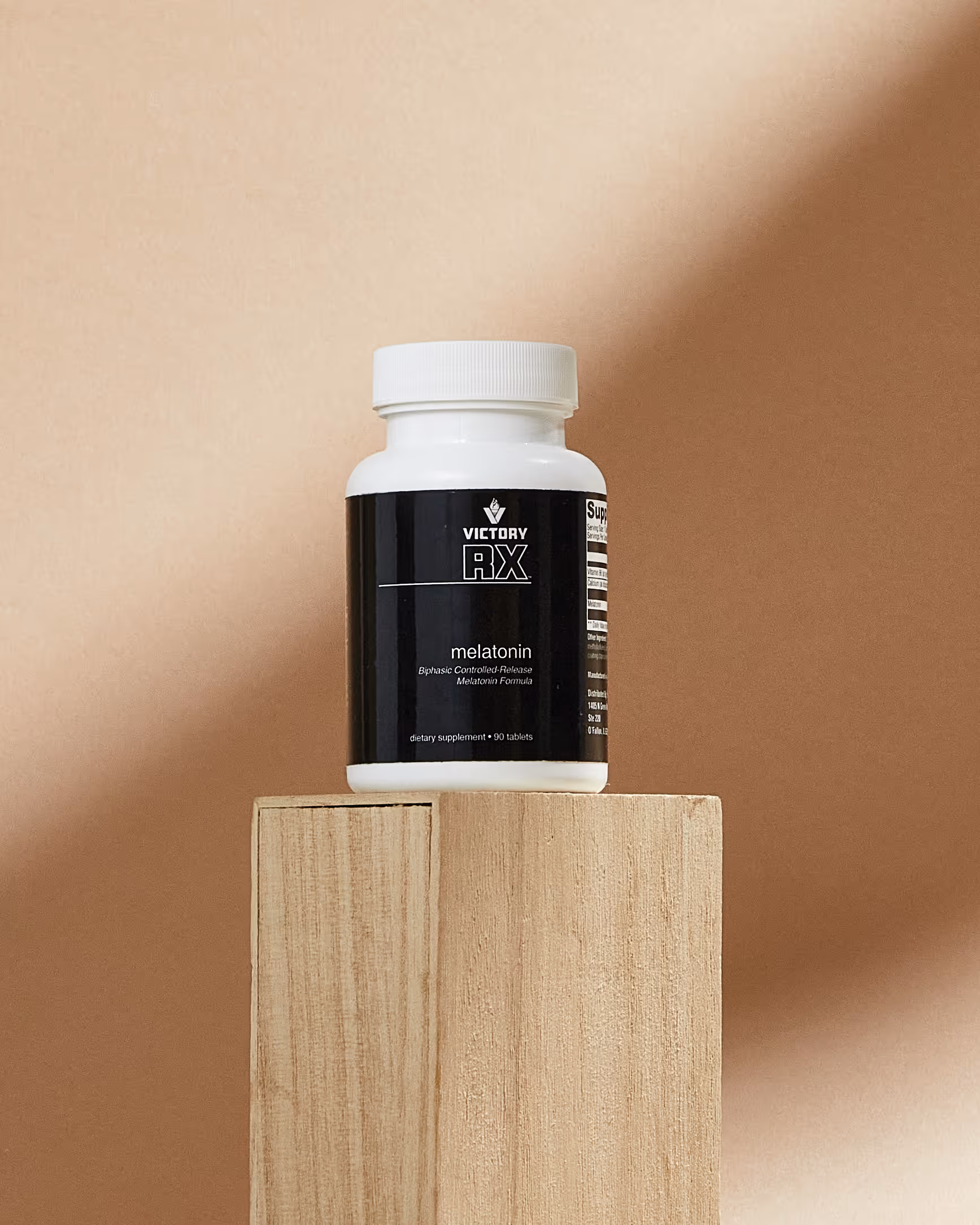 Melatonin supplement bottle used for sleep support and optimal dosing to improve sleep quality and circadian rhythm in adults