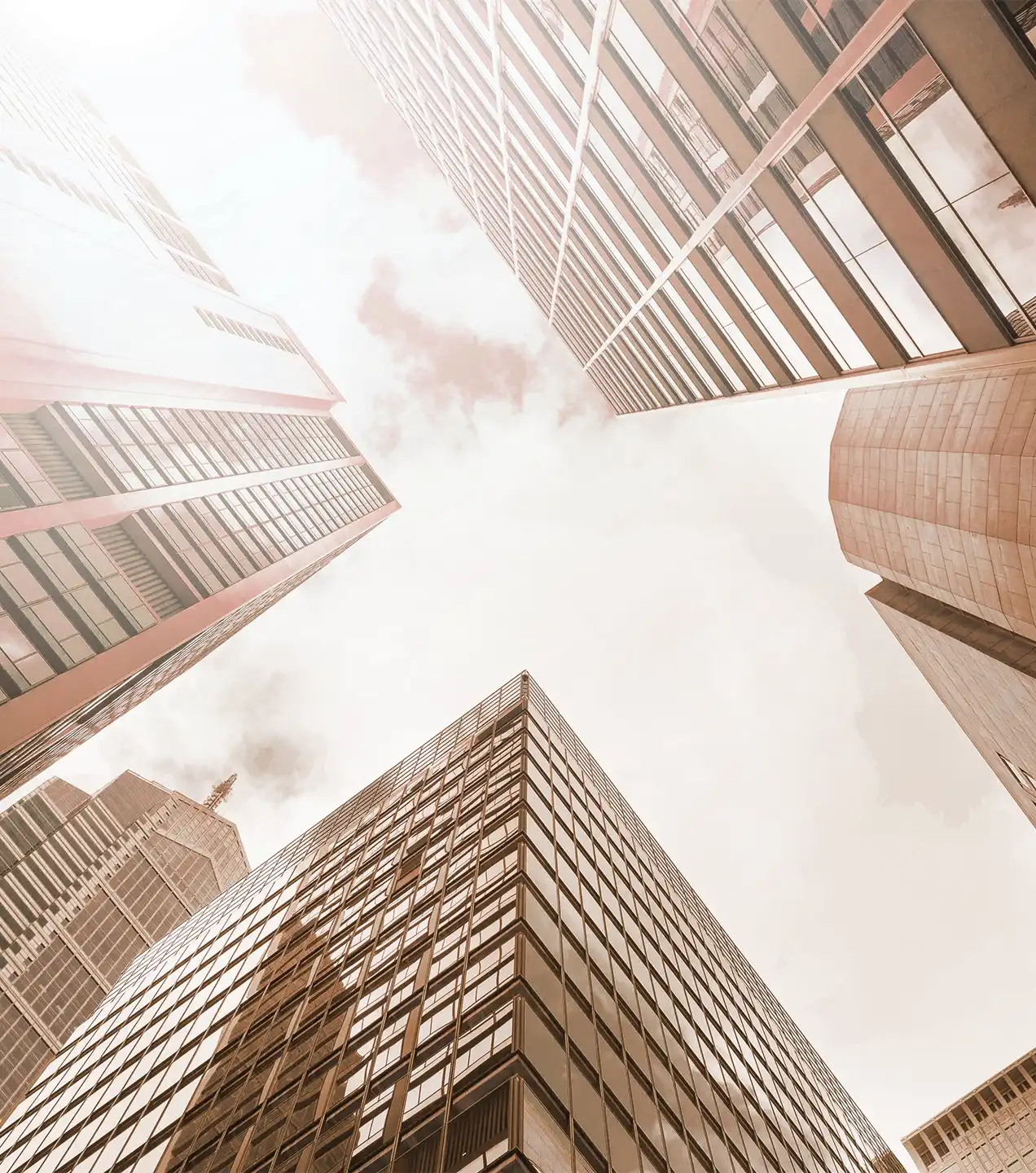 Skyscrapers in perspective representing growth in strategic corporate operations
