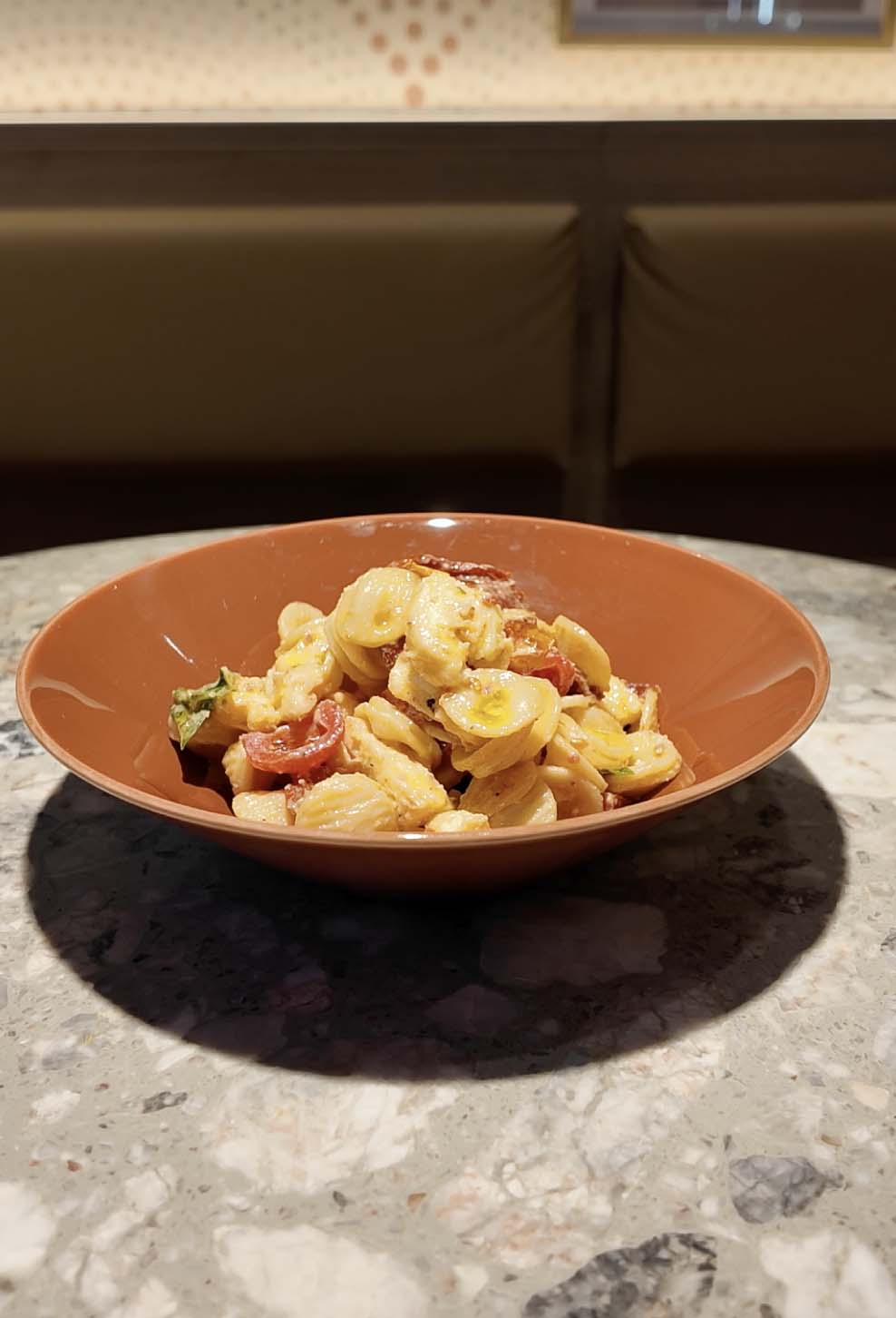 Italian style pizza with fresh cheese, herb, and small colourful tomatoes