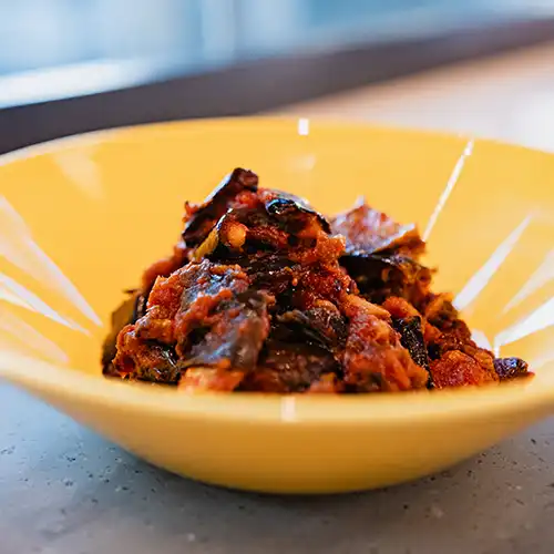 Italian style pizza with fresh cheese, herb, and small colourful tomatoes