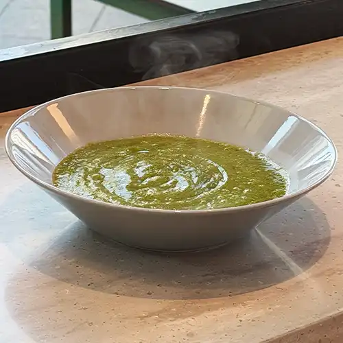 Italian style pizza with fresh cheese, herb, and small colourful tomatoes