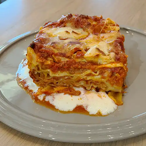 Italian style pizza with fresh cheese, herb, and small colourful tomatoes