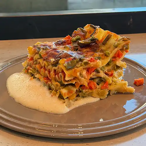 Italian style pizza with fresh cheese, herb, and small colourful tomatoes