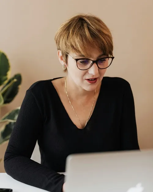 Woman working on laptop in creative studio