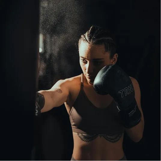 Female athlete in activewear showcasing movement and strength