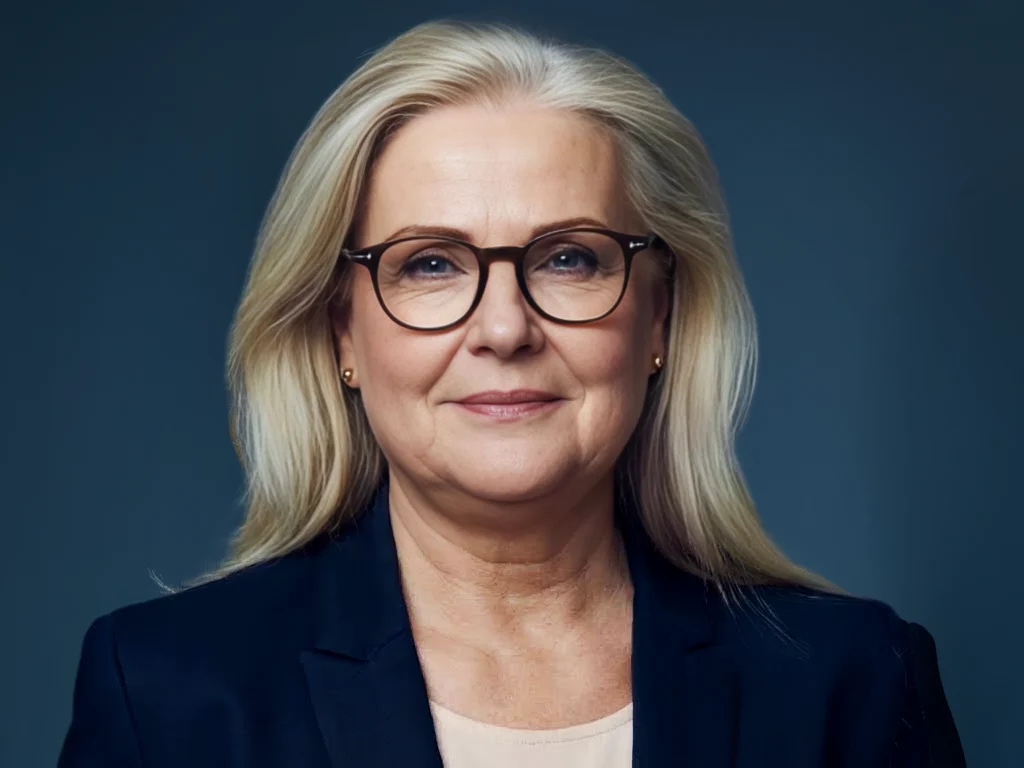 Dr. Tami Ehrmann Barr, Co-Founder, Chief Scientific Officer and Director, with long blonde hair and glasses, in a navy blazer