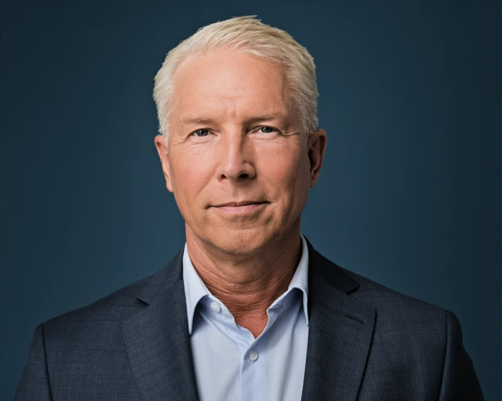 Dr. Dean Hakanson, Chief Medical Officer, a man with short light hair in a dark blazer and light blue shirt