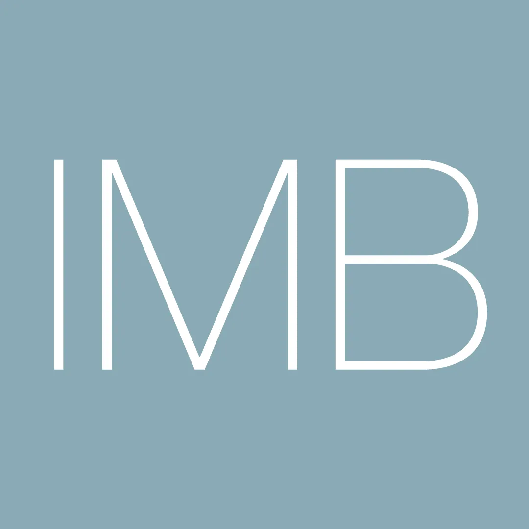 White IMB letters on a blue-grey square background.