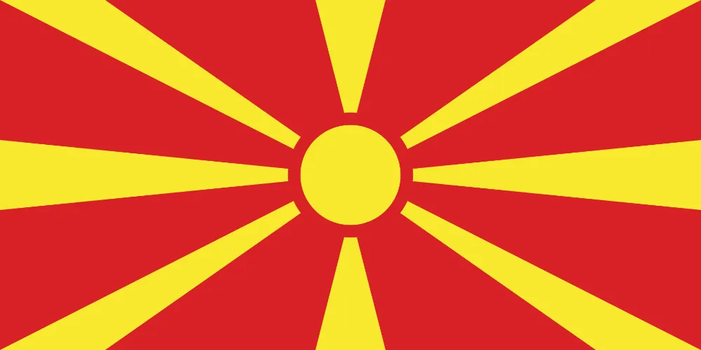 Drapeau de la Macédoine du Nord avec un soleil jaune et ses rayons sur fond rouge.