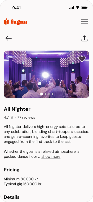 Crowd dancing and enjoying a lively party with purple lighting and decorative ceiling lights.