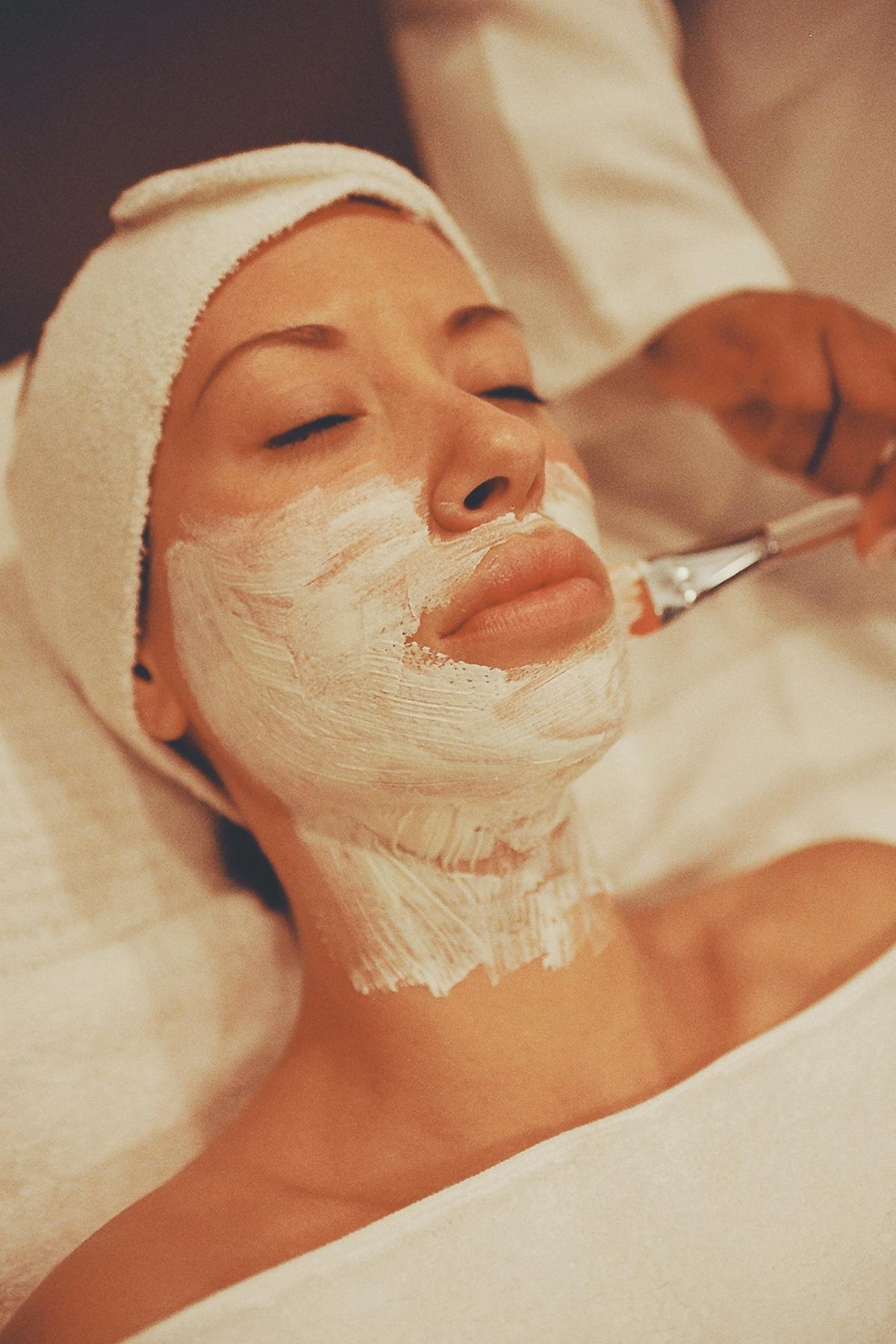 Bride preparing glowing skin with a facial before her wedding in Spring TX