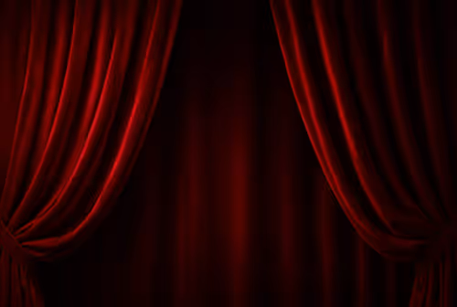 Deep red velvet stage curtains slightly open against a dark background.