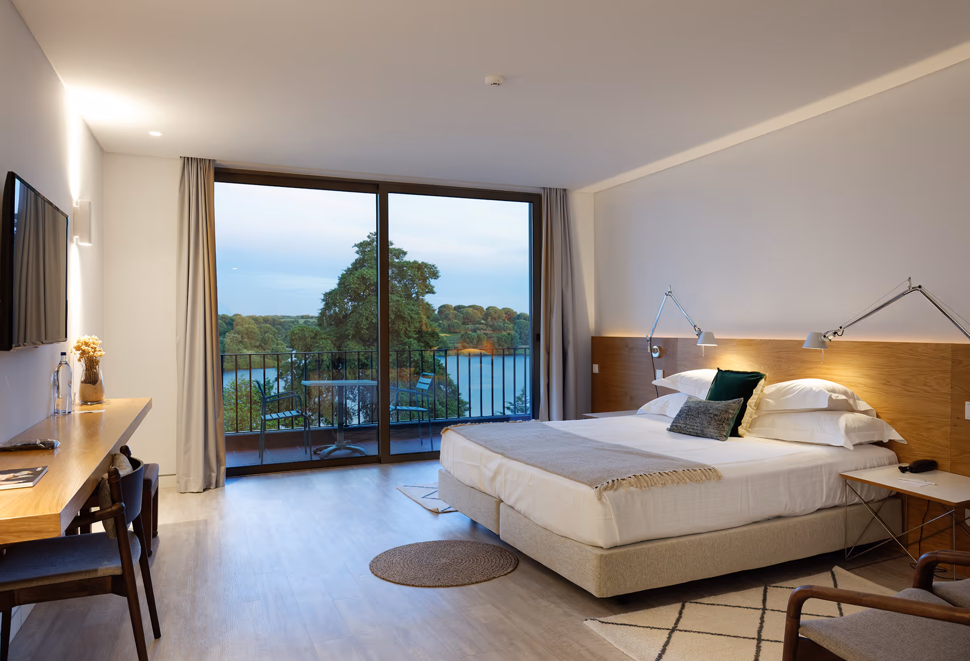 Guest room at Hotel Vale do Gaio with a private balcony over the reservoir
