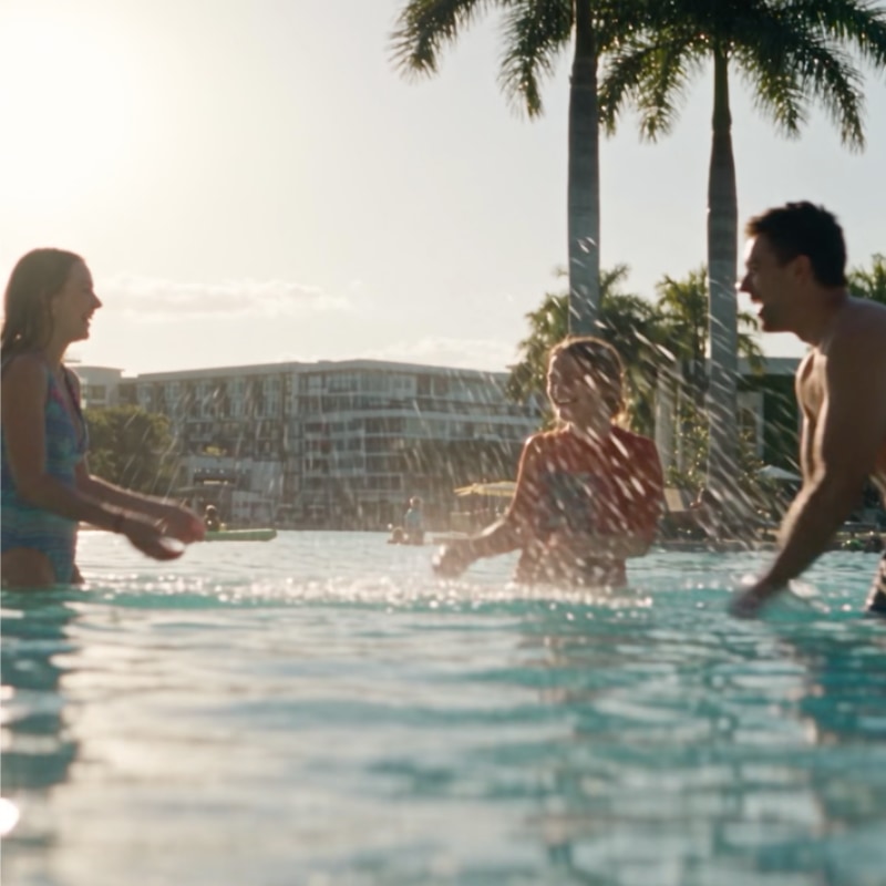 Friends splashing in the Miramar Cove lagoon at sunset, Fort Lauderdale
