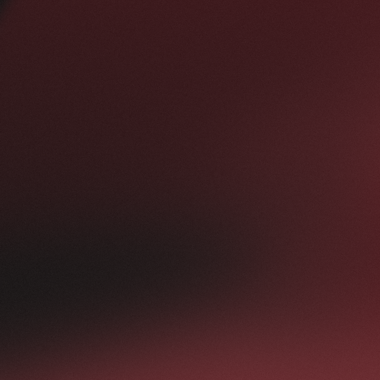 Verlaufshintergrund mit weichen Farbmischungen in Dunkelrot und Schwarz.