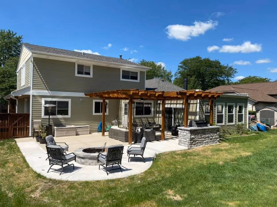 Backyard paver patio with seating and pergola