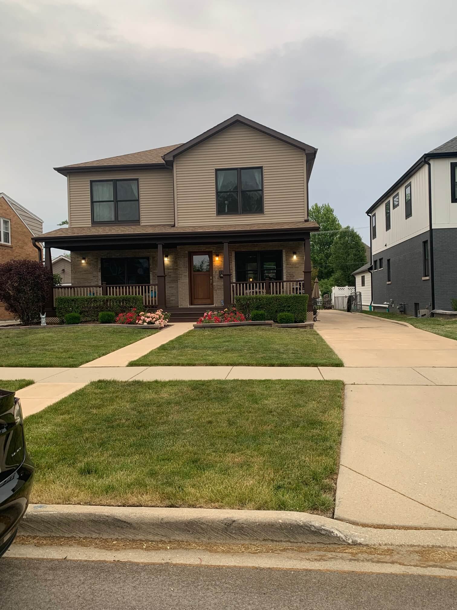 Backyard patio with a wooden pergola, ceiling fan, and built-in outdoor kitchen.
