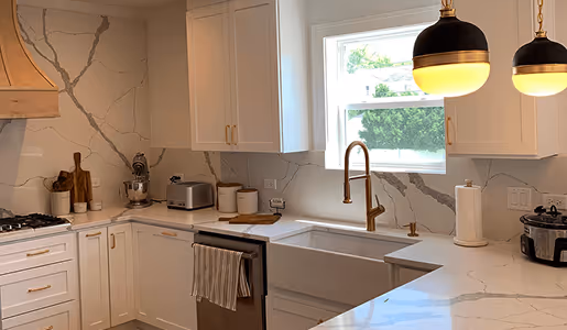 Luxury kitchen remodel Naperville - white marble countertops with brass fixtures