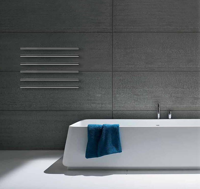 Bathroom setting with electric minimalist towel rail Foursteel M Slim in chrome