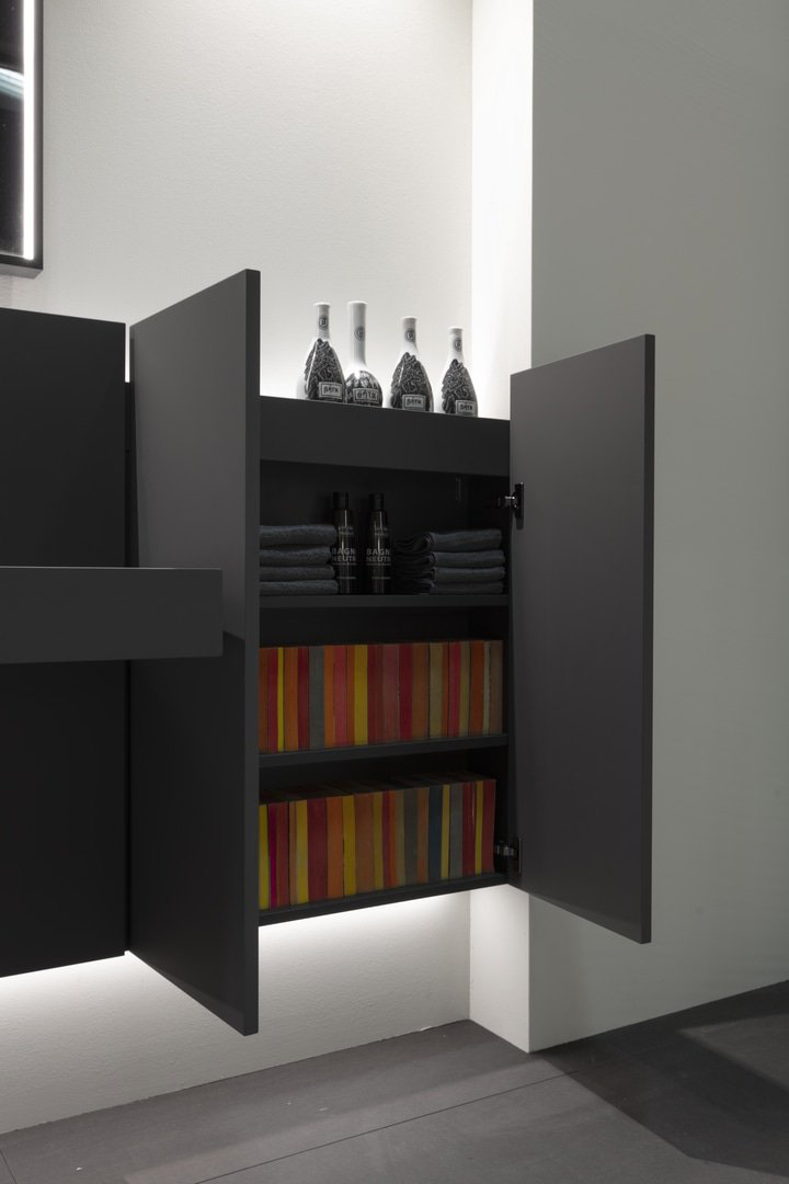 Detail of 2 doors of cabinets open for view of storage interior. Collection Showdown by Antonio Lupi.
