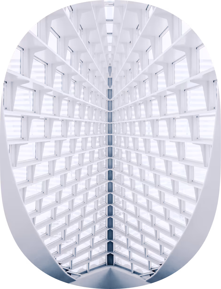 Symmetrical view of a white geometric ceiling with grid-like window patterns and bright light.