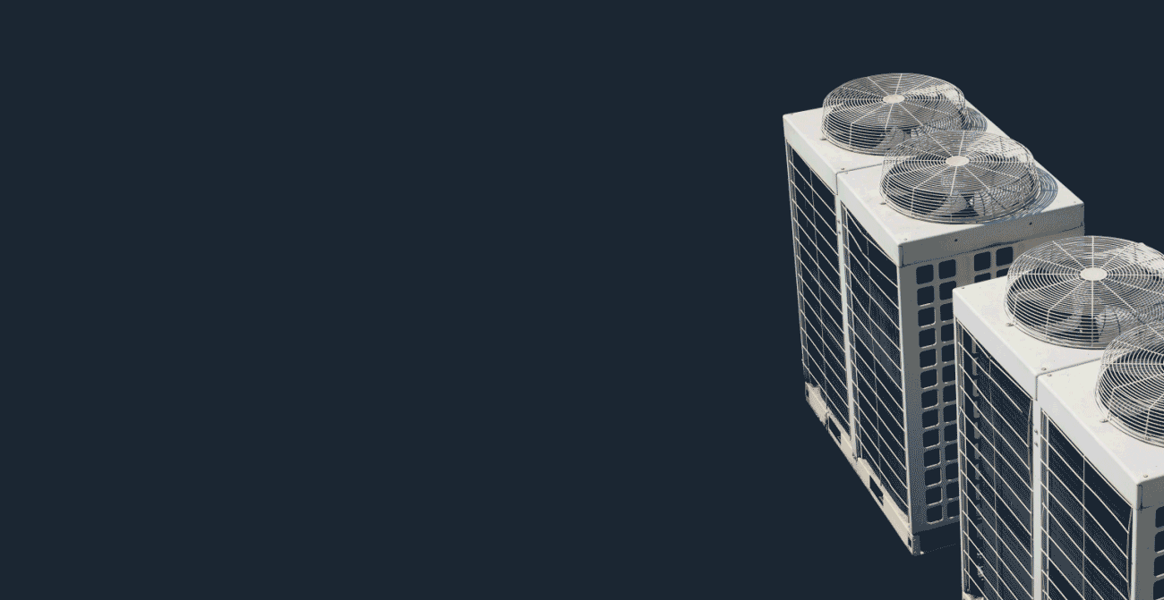 Top corner view of an industrial HVAC unit with two large ventilation fans.