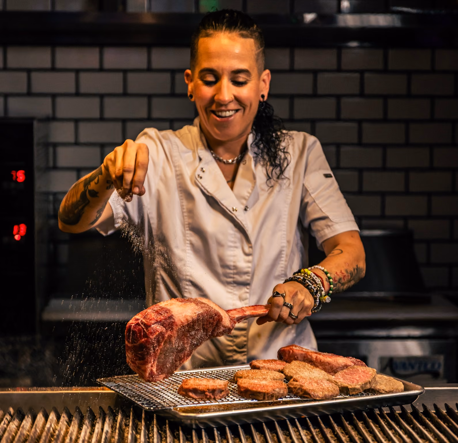 KAYA Prime chef preparing steaks on the grill