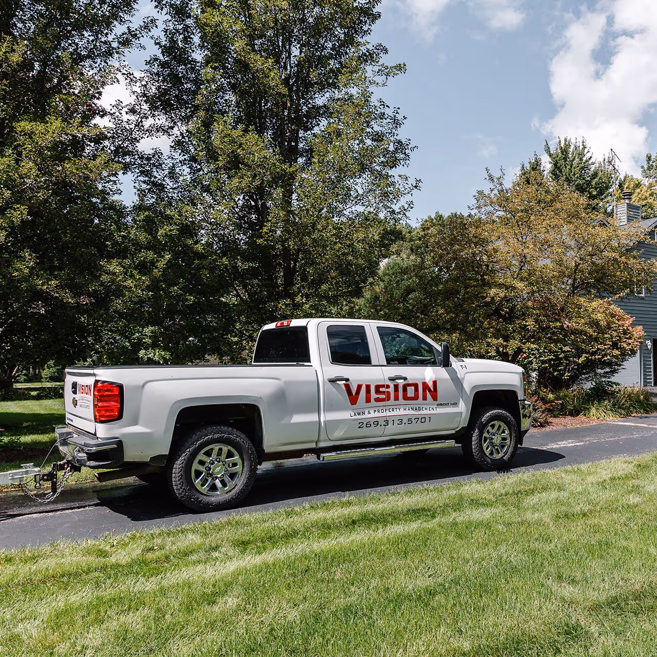 Vision Lawn and Property Management logo on company truck in Berrien County, Michigan