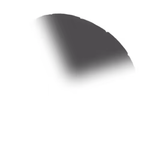 Close-up of a dark, rounded corner of a rectangular object with a subtle shadow on a black background.