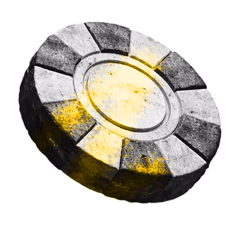Worn circular stone coin with black and white segments and yellow highlights.