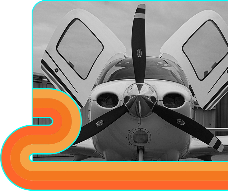 Piper aircraft, cowling open on the ramp