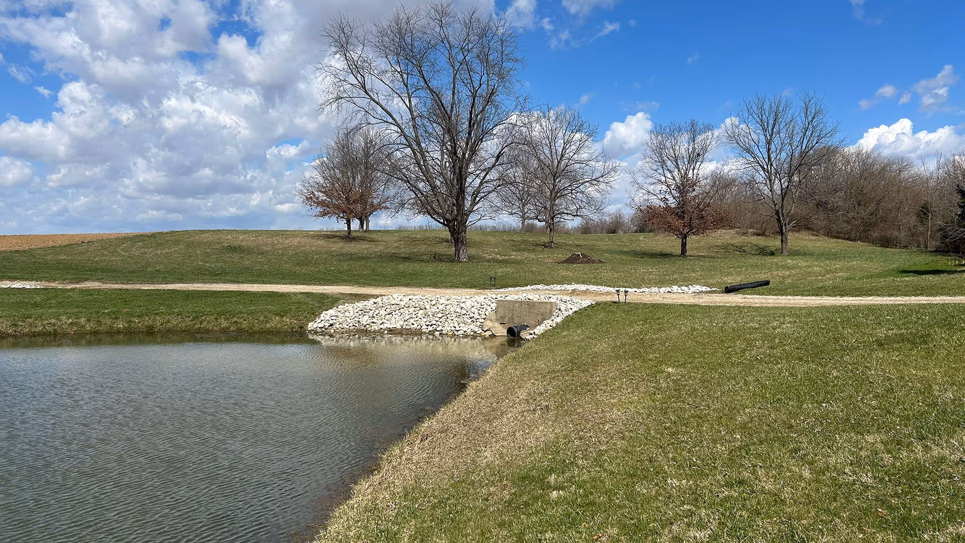 Residential drainage solutions in Okeana Ohio including French drains, catch basins, and storm water management