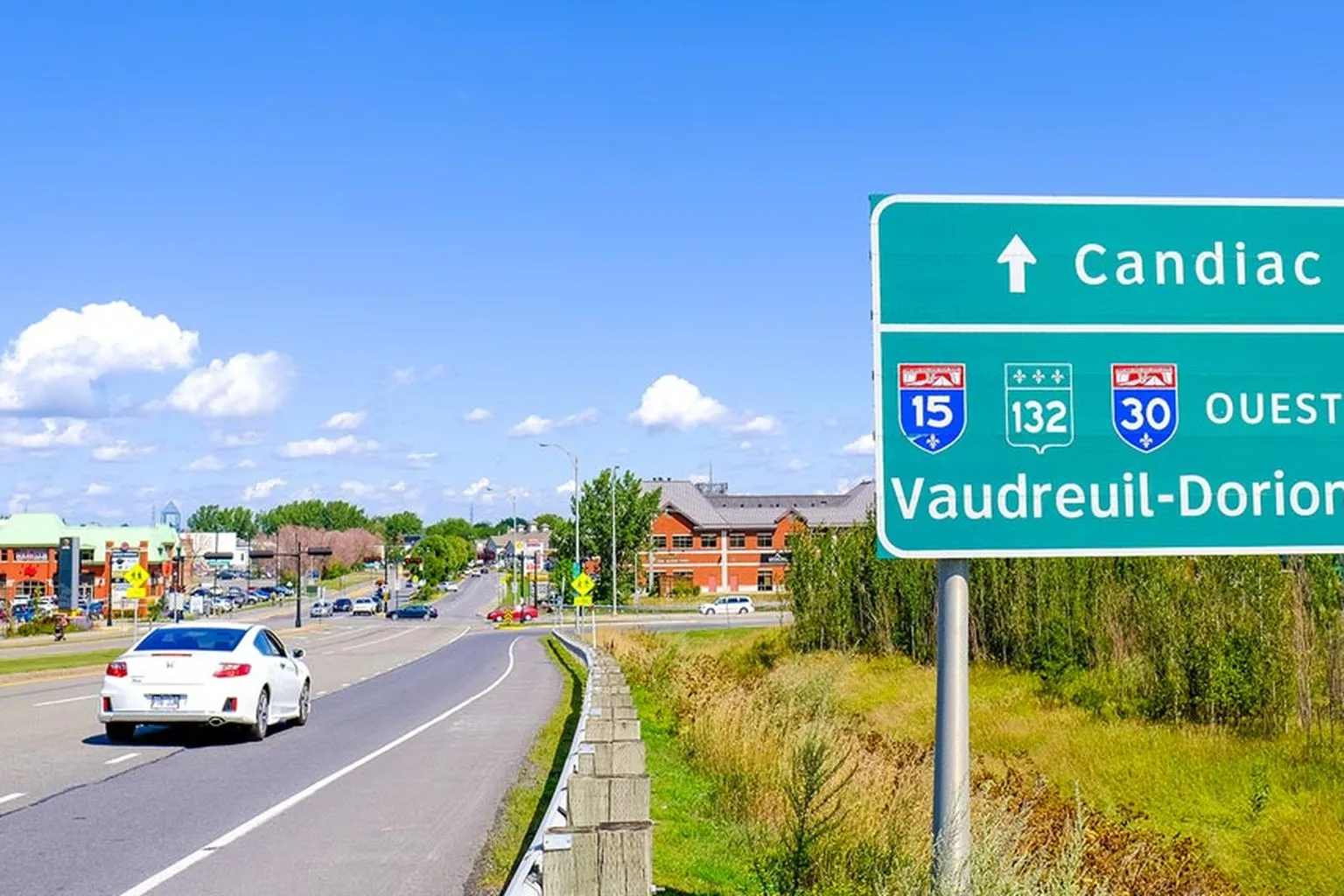 Panneau de sortie vers Candiac et les autoroutes 15 et 30