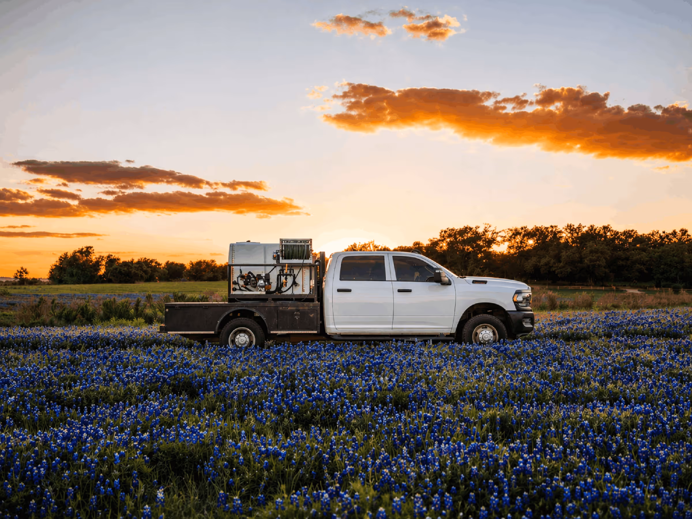 Bluebonnet Turf Co work truck providing lawn fertilization and weed control in Liberty Hill Texas