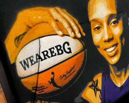 DTG print over the front pocket of a hooded sweatshirt