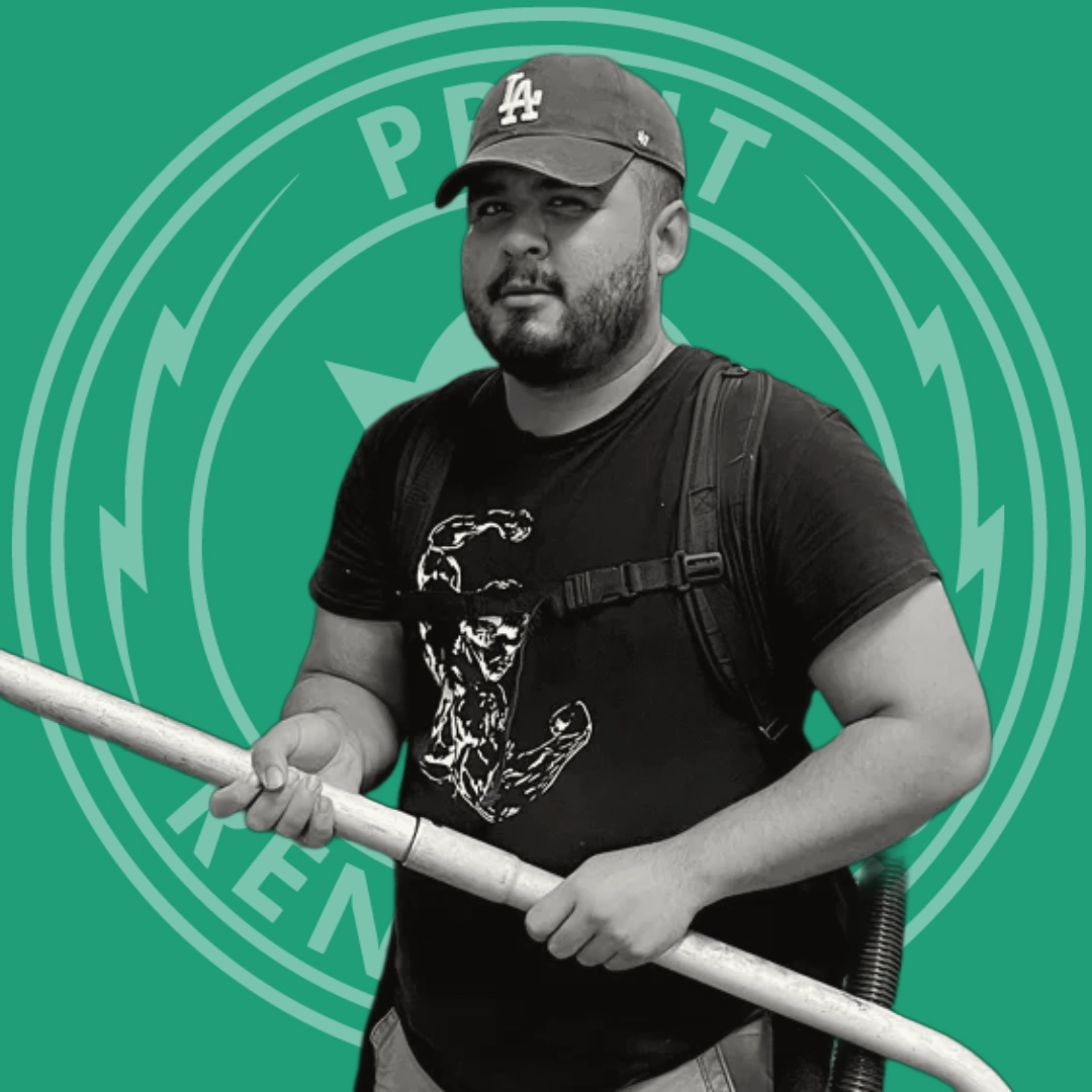Man wearing a black Los Angeles cap and t-shirt holding a long white pole with a strap across his chest against a green background with circular design.