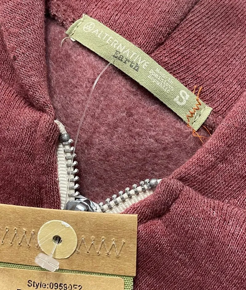 sewn on tag with two stitch points
