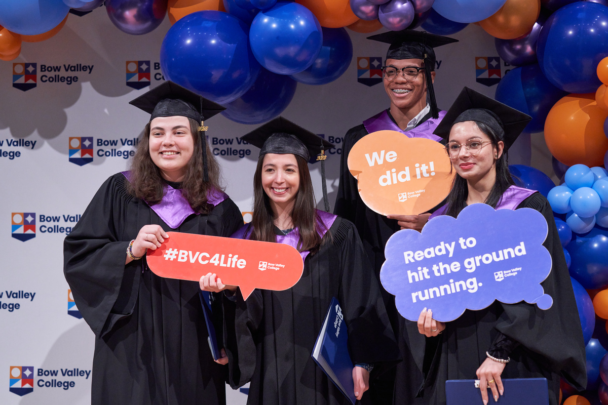 Bow Valley College graduates posing in front of the selfie booth