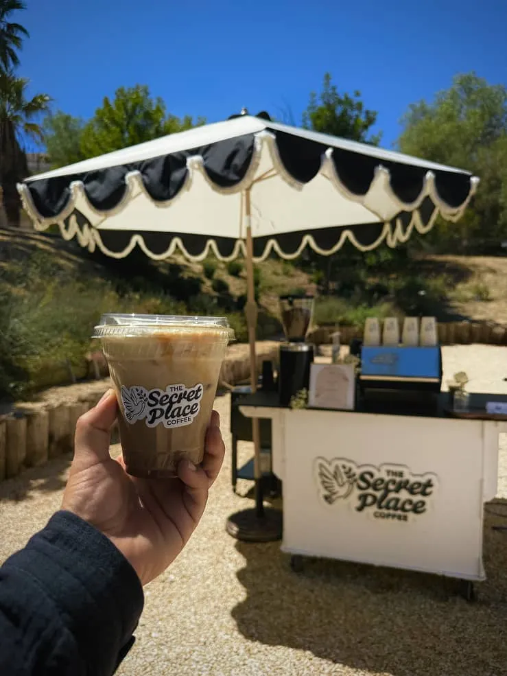 The Secret Place Coffee cart serving lattes at private event in Los Angeles